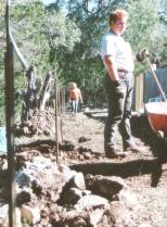 Bill in back of house with rocks!